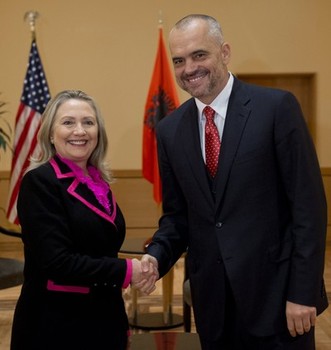 Hillary Clinton (left) and Albanian Xhakja Clan mafia crime leader Edi Rama (right)